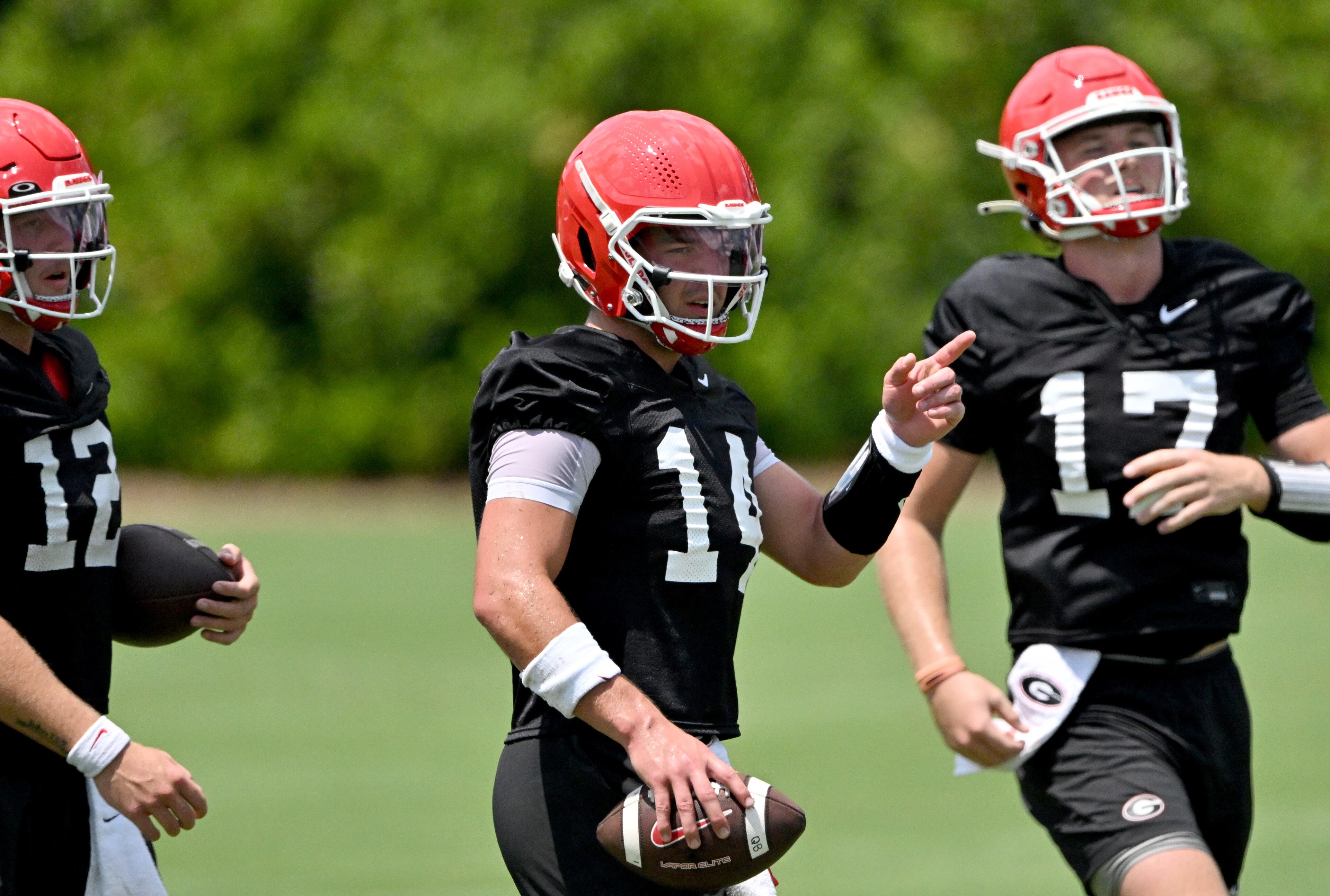 Georgia quarterback Gunner Stockton (14) and other players participate in a football practice at the University of Georgia practice facility, Thursday, July 31, 2025, in Athens. (Hyosub Shin / AJC)