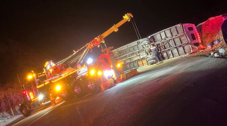This photo provided by Mario Sanchez shows a bus that was carrying teens and young adults returning from a church camp overturned after it lost control and tipped onto its side on a two-lane highway Sunday, Nov. 9, 2025, near Running Springs, Calif. (Mario Sanchez via AP)