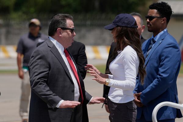U.S Ambassador William H. Duncan, left, receives Homeland Security Secretary Kristi Noem after she arrived at the Comalapa International Airport, in San Salvador, El Salvador, Wednesday, March 26, 2025. (AP Photo/Alex Brandon)
