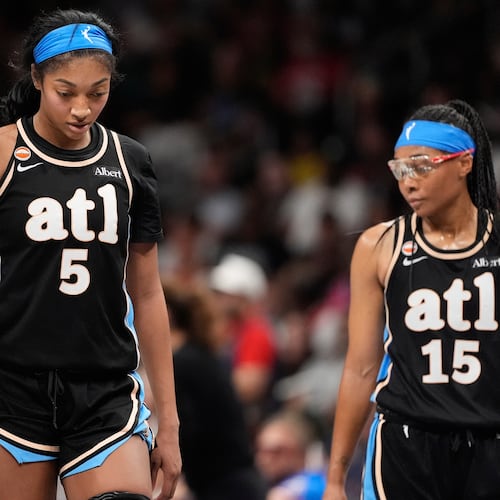 Atlanta Dream forward Angel Reese (5) and guard Allisha Gray (15) react in the second half of an WNBA basketball game Sunday, Aug. 16, 2026, in Atlanta. (AP Photo/Brynn Anderson)