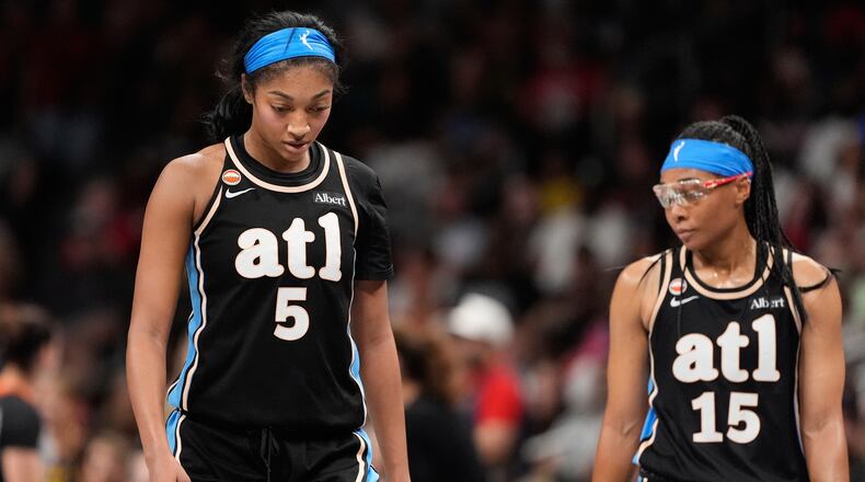 Atlanta Dream forward Angel Reese (5) and guard Allisha Gray (15) react in the second half of an WNBA basketball game Sunday, Aug. 16, 2026, in Atlanta. (AP Photo/Brynn Anderson)