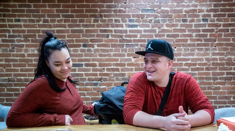 Kenneth Caban Gonzalez, and his fiancee, Beatriz Rodriguez, talk Monday about his experience with the Georgia Department of Driver Services. STEVE SCHAEFER / SPECIAL TO THE AJC