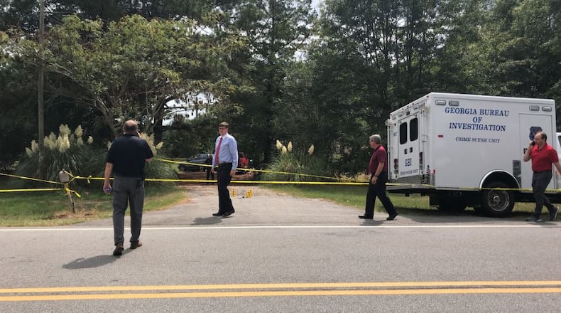 The bodies were found about 9:30 a.m. at a home along Sparta Highway.