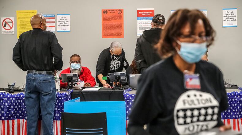 Several dozen voters were there in the first hour of early voting at the Buckhead Library in Atlanta on Oct. 17, 2022. Georgia's total turnout could reach record levels for a midterm election, with more than 4 million voters expected. (John Spink/The Atlanta Journal-Constitution/TNS)