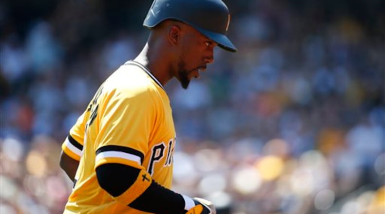 Pittsburgh Pirates' Andrew McCutchen returns to the dugout during a baseball game against the Milwaukee Brewers in Pittsburgh, Sunday, April 17, 2016. (AP Photo/Gene J. Puskar)
