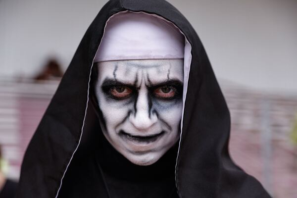 Emris Eillis Harper, who plays a nun and an owl cultist, drove 2,800 miles from Oregon for the job at Six Flags Over Georgia Fright Fest. “You can’t just scare someone once — you have to haunt them,” she says. (Natrice Miller/AJC)