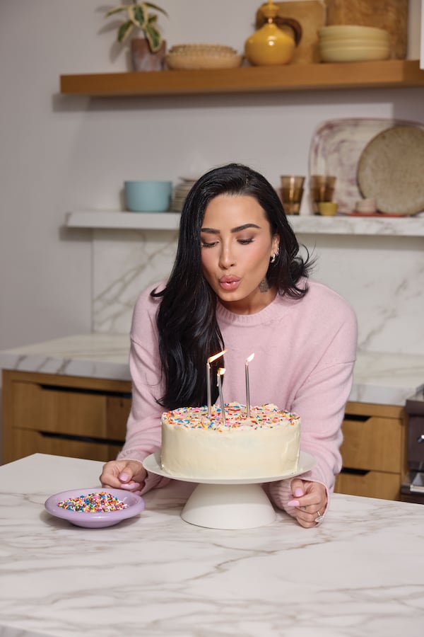 In "One Plate at a Time: Recipes for Finding Freedom with Food" (Flatiron Books, $34.99), Demi Lovato shares her Favorite Birthday Cake recipe. (Courtesy of Flatiron Books / Photos by Matt Armendariz)