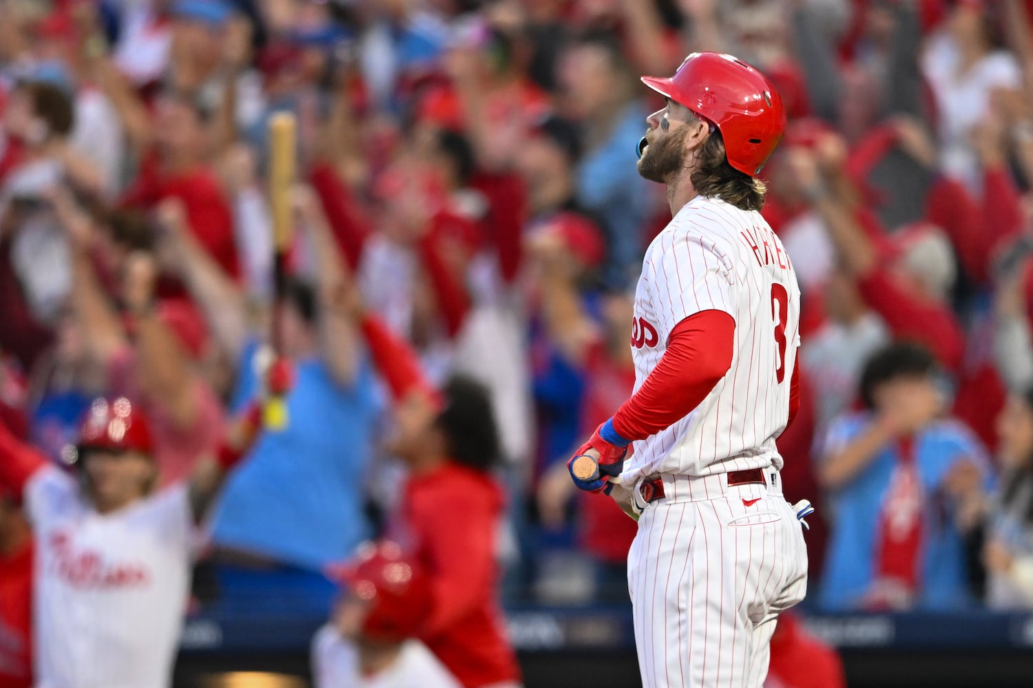 Philadelphia Phillies’ Bryce Harper (3) watches a 3-RBI home run against the Atlanta Braves that scored Brandon Marsh and Trea Turner during the third inning of NLDS Game 3 in Philadelphia on Wednesday, Oct. 11, 2023.   (Hyosub Shin / Hyosub.Shin@ajc.com)