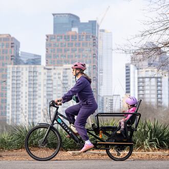 A mother and daughter ride an e-bike through Piedmont park on Wednesday, Jan 7, 2026 (Ben Hendren for the AJC)
