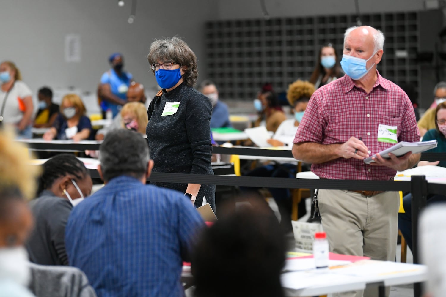Observers watch as votes for President are recounted at the Gwinnett County elections office on Friday, Nov.13, 2020 in Lawrenceville. (JOHN AMIS FOR THE ATLANTA JOURNAL-CONSTITUTION)