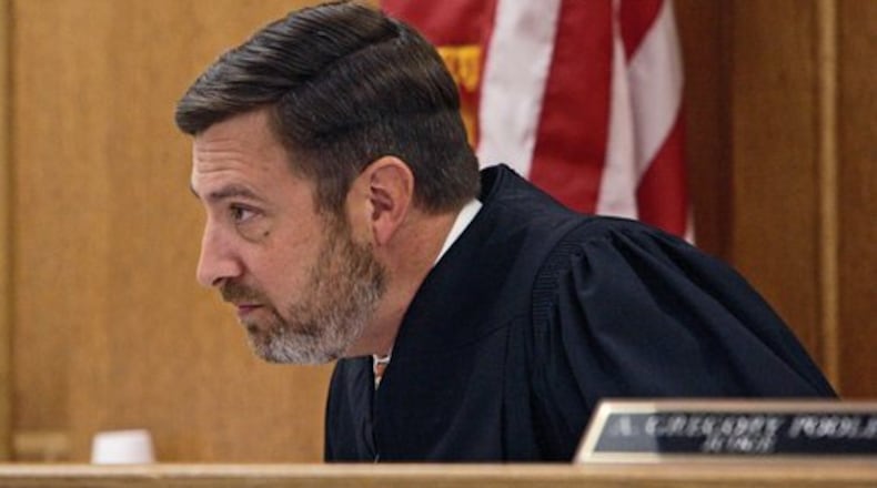Judge Gregory Poole, shown in a 2020 AJC file photo, recently dropped charges against a man accused of murder.