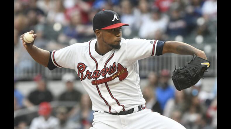Julio Teheran fires a pitch in Saturday night’s win against the Mets. He worked seven scoreless innings to continue his career-long success against the Mets and reduce Braves’ starters ERA to 1.97 in the past 15 games. (AP Photo/John Amis)