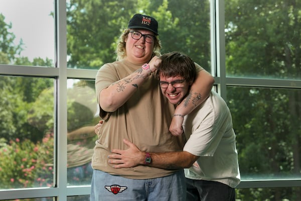 Harlow Phillips (left) and Tyler Mabry, of the emo-folk duo Hey, Nothing, goof around in a community building inside Bunten Road Park on Monday, Aug. 17, 2026, in Duluth. (Jason Getz/AJC)