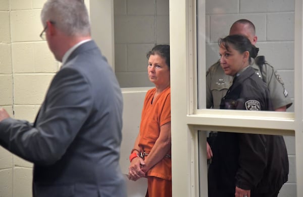 Attorney Michael Ray watches as Melody Farris is escorted in for her first appearance before Chief Judge James Drane at Cherokee County Magistrate Court in the Cherokee County Detention Center in Canton on June 21, 2019. (Hyosub Shin/AJC)
