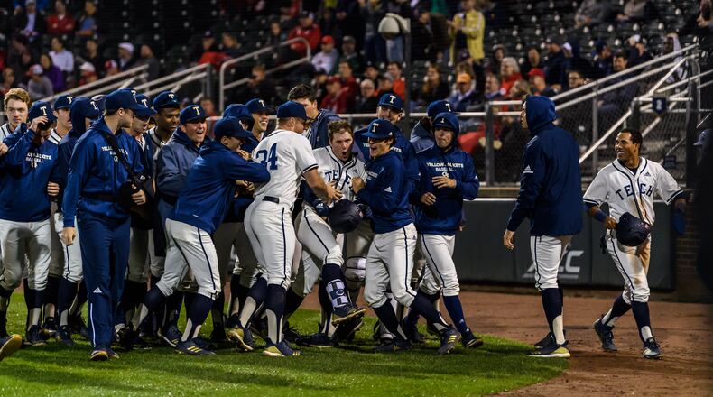 Georgia Tech shortstop Luke Waddell (holding helmet in hand) is mobbed by teammates after his fifth-inning home run against Georgia in the Yellow Jackets' 11-2 win over the Bulldogs March 26, 2019 at Russ Chandler Stadium. (Danny Karnik/Georgia Tech Athletics)