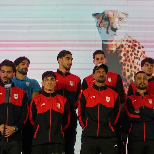 Iran's national soccer team players stand onstage as they are greeted by a crowd during a pro-government gathering before their departure for training and friendly matches in Turkey ahead of the World Cup at Islamic Revolution Square in Tehran, Iran, Wednesday, May 13, 2026. (AP Photo/Vahid Salemi)