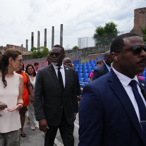 Chicago's Mayor Brandon Johnson, center, arrives for a tour at the Metro C Colosseum train station in Rome, Friday, May 29, 2026. (AP Photo/Alessandra Tarantino)