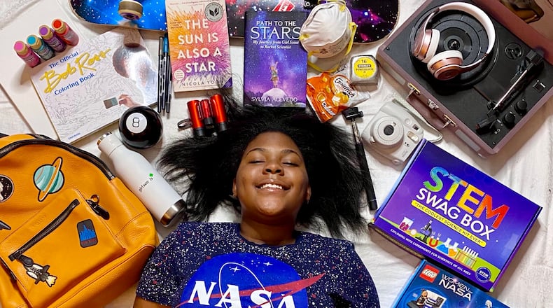 Temple Lester runs an online STEM education and retail site to get her peers, especially girls, to share her excitement for the sciences. The 17-year-old is pictured with her STEM Swag Box, a multi-use science kit for elementary and middle school students. Photo courtesy of Temple Lester