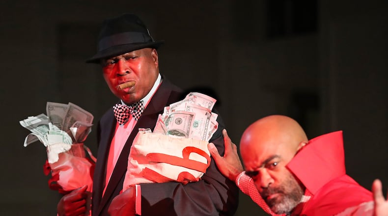The greedy rich man, played by Floyd Baxter, is lead away to Hell by Satan, played by Glenn Samuels, during rehearsals for the 86th annual run of “Heaven Bound” at Big Bethel AME Church in Atlanta. Curtis Compton/ccompton@ajc.com