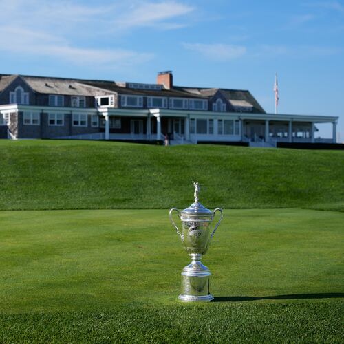 FILE - The U.S. Open Golf Championship trophy is displayed in front of the clubhouse at Shinnecock Hills Golf Club in Southampton, N.Y., Sept. 15, 2025. (AP Photo/Seth Wenig, File)