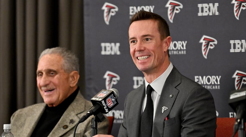 New Atlanta Falcons president of football Matt Ryan speaks as Falcons owner Arthur M. Blank (left) reacts during an introductory news conference Jan. 13, 2026, in Flowery Branch. It is now thought Ryan could be leaning toward James Liipfert as the team's new general manager. (Hyosub Shin/AJC)