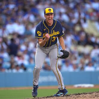 Milwaukee Brewers starting pitcher Jacob Misiorowski, left, celebrates after striking out Los Angeles Dodgers' Tommy Edman during the sixth inning of a baseball game Saturday, Aug. 15, 2026, in Los Angeles. (AP Photo/Mark J. Terrill)