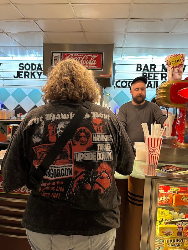 Emily Hardaway, a Marietta communications director for the city of Douglasville, came to the Tara on New Year’s Eve to view the final episode of “Stranger Things” specifically for the “shared experience.” (Rodney Ho/AJC)