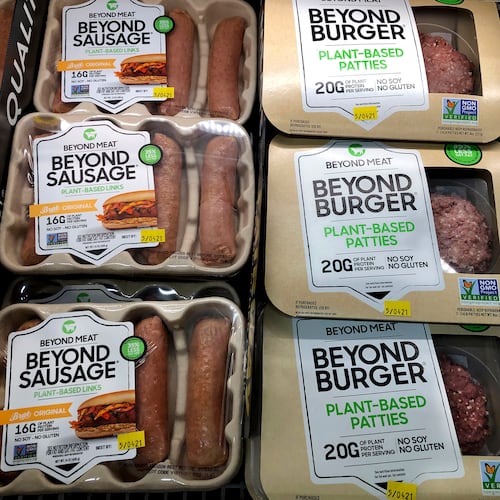 FILE - Packages of Beyond Meat's Beyond Burgers and Beyond Sausage, are shown in this photo, in New York, April 29, 2021. (AP Photo/Richard Drew, File)