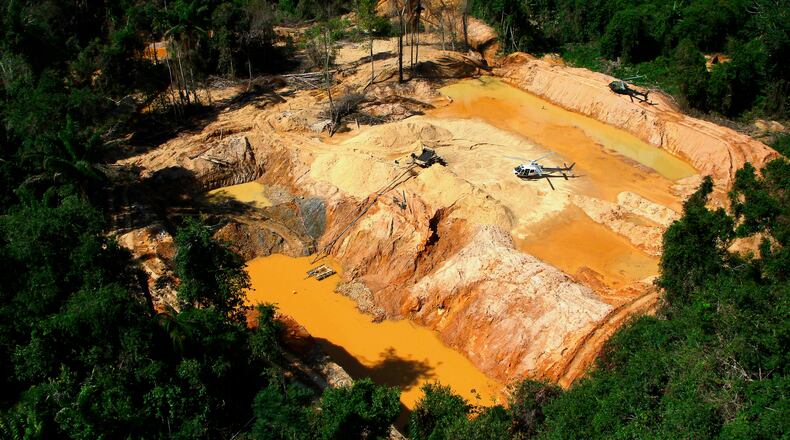 FILE - An illegal mining camp is visible from a Brazil Environmental Agency helicopter during an operation to try to contain illegal mining in Yanomami Indigenous territory, Roraima state, Brazil, Feb. 11, 2023. (AP Photo/Edmar Barros, File)