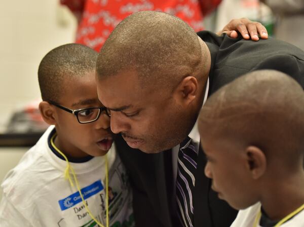 June 13, 2018 Jonesboro - David Dare (left) whispers to Clayton Schools Superintendent Morcease J. Beasley as Beasley visits students and staff at Camp Invention, a STEM summer camp, at Callaway Elementary School in Jonesboro on Wednesday, June 13, 2018. HYOSUB SHIN / HSHIN@AJC.COM