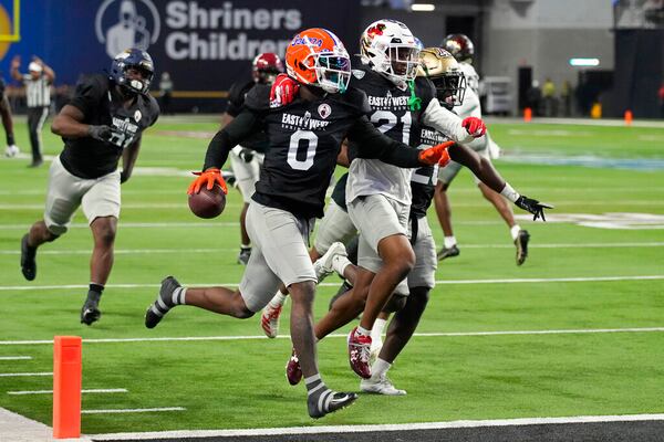 West safety Trey Dean III (0) of Florida celebrates after making an interception during the first half of the East-West Shrine Bowl NCAA college football game Thursday, Feb. 2, 2023, in Las Vegas. (AP Photo/John Locher)
