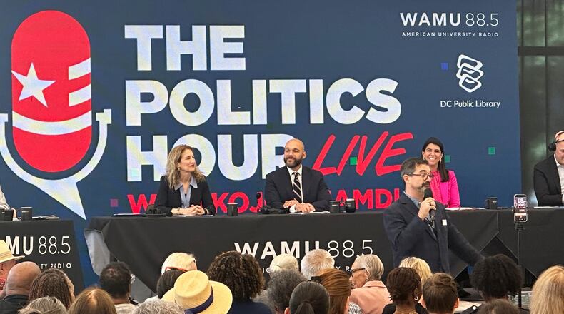 Robert White Jr., center, and Brooke Pinto, right, candidates for Washington D.C. delegate, participate in a forum at the Martin Luther King Jr. Memorial Library, Friday, May 29, 2026. (AP Photo/Gary Fields)
