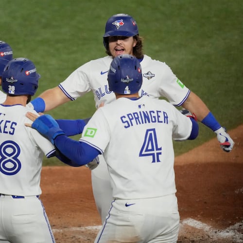 Toronto Blue Jays' Addison Barger celebrates his grand slam home run against the Los Angeles Dodgers during the sixth inning in Game 1 of baseball's World Series, Friday, Oct. 24, 2025, in Toronto. (AP Photo/Brynn Anderson)