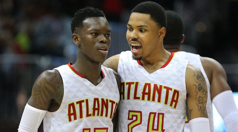 April 24, 2017, Atlanta: Dennis Schroder and Kent Bazemore celebrate a 111-101 victory over the Wizards in game 4 of a first-round NBA basketball playoff series on Monday, April 24, 2017, in Atlanta.  Curtis Compton/ccompton@ajc.com