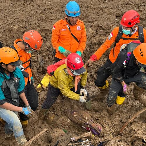 In this photo released by the Indonesian National Search and Rescue Agency (BASARNAS), rescuers search for victims in Pasir Langu village after a landslide, in West Bandung district of West Java province, Indonesia, Sunday, Jan. 25, 2026. (BASARNAS via AP)