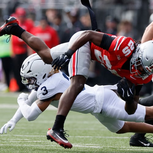 Ohio State running back Bo Jackson, top, is tackled by Penn State defensive back Antoine Belgrave-Shorter during the first half of an NCAA college football game, Saturday, Nov. 1, 2025, in Columbus, Ohio. (AP Photo/Jay LaPrete)