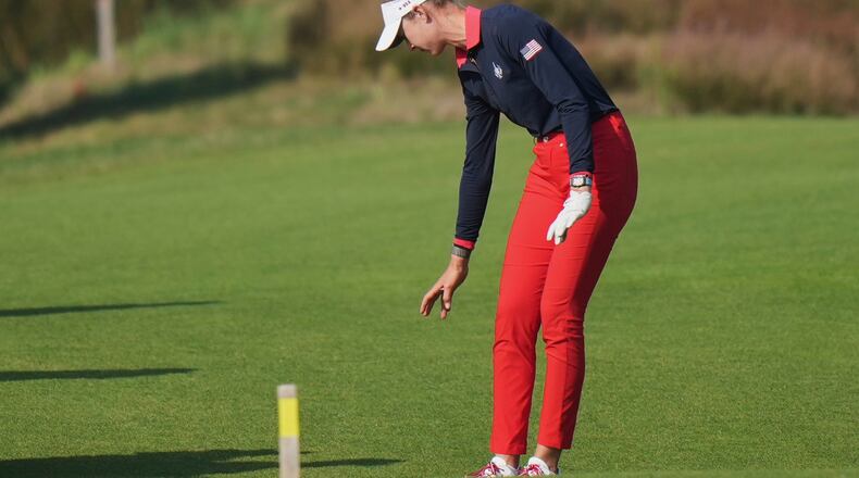Nelly Korda of the United States takes a drop on the 16th fairwayduring the Solheim Cup at the Bernardus Golf course in Den Bosch, Netherlands, Saturday, Sept. 12, 2026. (AP Photo/Alastair Grant)