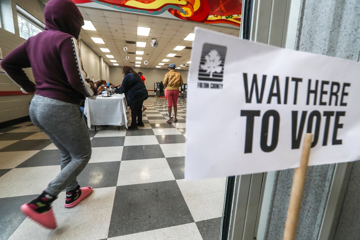 December 6, 2022 Atlanta: Voters enter on Tuesday, Dec. 6, 2022 at the C.T. Martin Natatorium and Recreation Center located at 3201 M.L.K. Jr Drive SW in Atlanta. It’s been a marathon, not a sprint, for Georgia voters to settle on a long-term replacement for the late U.S. Sen. Johnny Isakson, who resigned from the Senate in 2019 amid ongoing health concerns. One gubernatorial appointment and five statewide elections later, Tuesday’s U.S. Senate runoff election in Georgia will finally decide who will represent Georgia in the Senate for a full, six-year term. In Walker’s final speech at the Governor’s Gun Club, he told a small crowd, “The best thing I’ve ever done, including the Heisman Trophy, and the Horatio Alger award, the best thing I’ve ever done is run for office right here.” Late Monday night, Warnock Tweeted a final message. “I’ve said it before and I’ll say it again, I can’t have Herschel Walker representing my mama.” Most of the runoff polling put Warnock, the Democratic incumbent, slightly ahead of, but statistically tied with his Republican challenger. (John Spink / John.Spink@ajc.com)