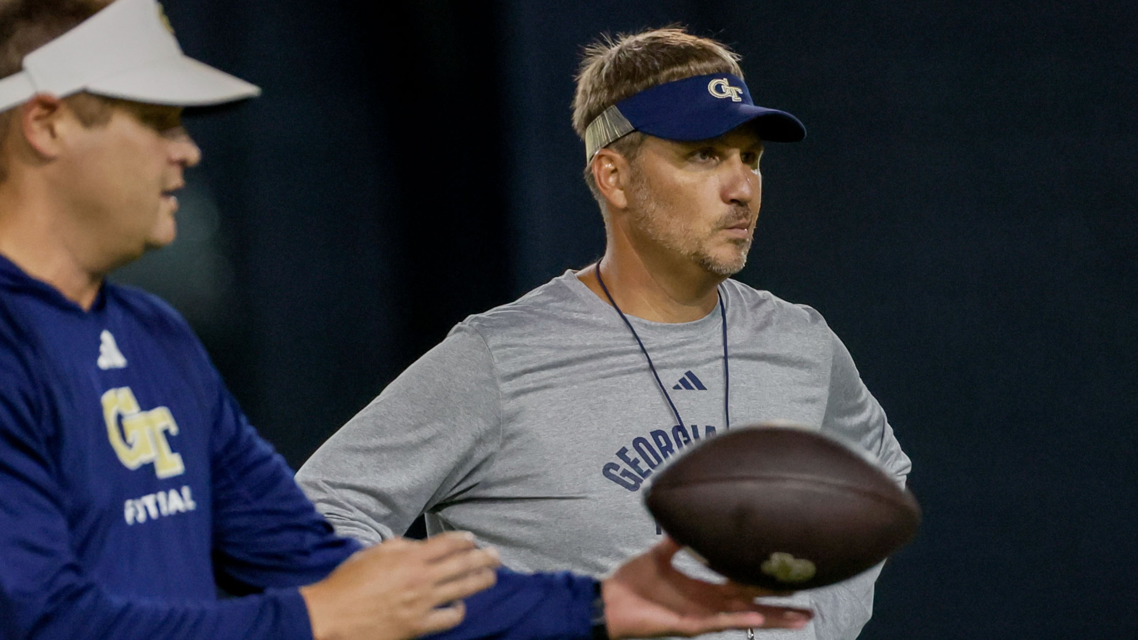 Offensive Coordinator Buster Faulkner (center) watches the team working on a drill during the second day of football practice at the Brock Indoor Practice Facility on Thursday, July 25, 2024, in Atlanta.
(Miguel Martinez / AJC)