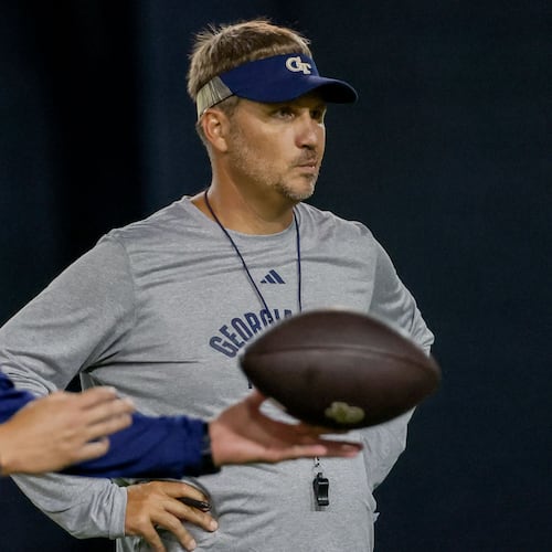 Offensive Coordinator Buster Faulkner (center) watches the team working on a drill during the second day of football practice at the Brock Indoor Practice Facility on Thursday, July 25, 2024, in Atlanta.
(Miguel Martinez / AJC)