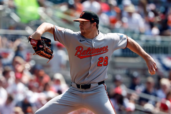 Baltimore Orioles pitcher Trevor Rogers throws during the first inning of a baseball game against the Atlanta Braves, Sunday, July 6, 2025, in Atlanta. (AP Photo/Butch Dill)