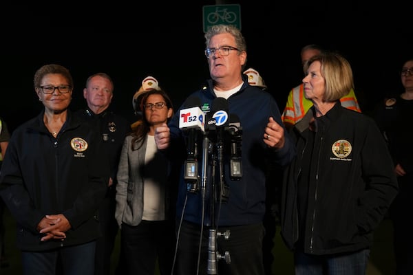 From left, Los Angeles Mayor Karen Bass, left, LAPD Chief Jim McDonnell, Congresswoman Nanette Barragan Los Angeles Council member Tim McOsker, at microphone, and Supervisor Janice Hahn take questions from the media after all the workers who were trapped in the Wilmington tunnel were out and accounted, Wednesday, July 9, 2025, in Los Angeles. (AP Photo/Damian Dovarganes)