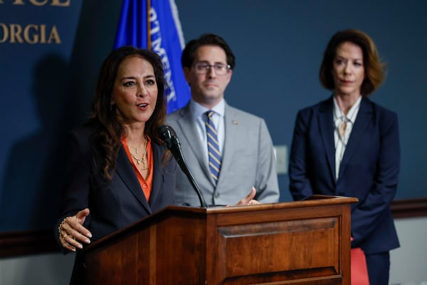 DOJ Assistant Attorney General for Civil Rights Harmeet Dhillon (left) speaks during a news conference in March. (Miguel Martinez/AJC)
