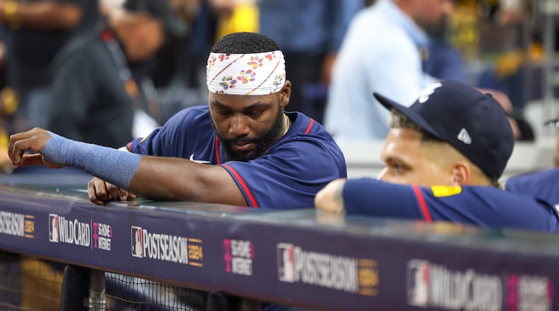 Atlanta Braves outfielder Michael Harris, left, reacts from the dugout with pitcher Joe Jiménez after losing to the San Diego Padres 5-4 in National League Division Series Wild Card Game Two at Petco Park in San Diego on Wednesday, Oct. 2, 2024. The Padres advance to the Division Series to face the Los Angeles Dodgers.  (Jason Getz / Jason.Getz@ajc.com)