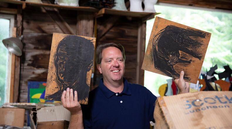 "Legacy List" host Matt Paxton holds up pieces from artist David Hayes at his studio in Coventry, Conn., in an episode from season two of the show. MUST CREDIT: JR Delia/Legacy List