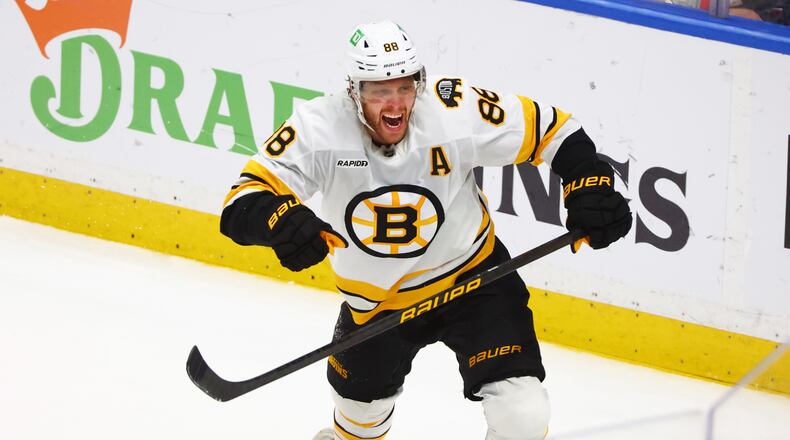 Boston Bruins right wing David Pastrnak (88) celebrates his goal during the overtime period in Game 5 of a first-round NHL hockey Stanley Cup playoff series against the Buffalo Sabres Tuesday, April 28, 2026, in Buffalo, N.Y. (AP Photo/Jeffrey T. Barnes)