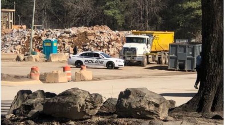 Police said the driver shot outside a Doraville recycling plant last week remains in the hospital in serious condition.