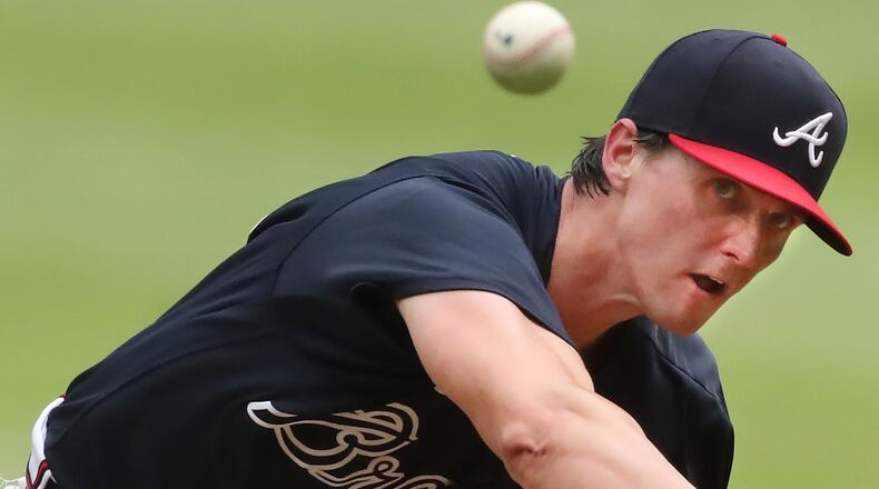 Braves pitcher Kyle Wright delivers a pitch against the Miami Marlins during the third inning of an exhibition game last week.