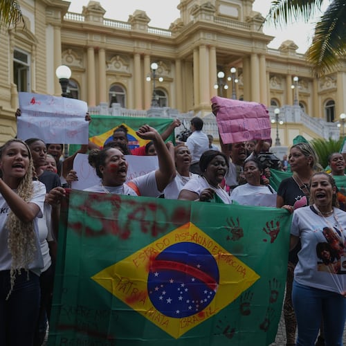 Penha favela residents protest in front of the Guanabara Palace against a deadly police operation on alleged drug traffickers of the Comando Vermelho gang, in Rio de Janeiro, Wednesday, Oct. 29, 2025. (AP Photo/Silvia Izquierdo)