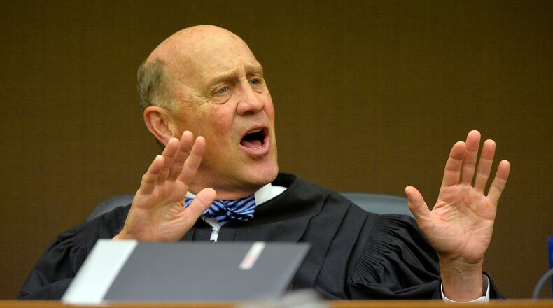 Fulton County Superior Court Judge Jerry Baxter denies motions by defense attorneys Hurl Taylor and Gerald Griggs to allow tribunal transcripts for their clients former APS Usher Collier Heights Elem testing coordinator Donald Bullock and former APS Dobbs Elementary teacher Angela Williamson into the court record Thursday morning. KENT D. JOHNSON / KDJOHNSON@AJC.COM